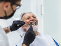 Senior man having dental treatment at dentist's office.